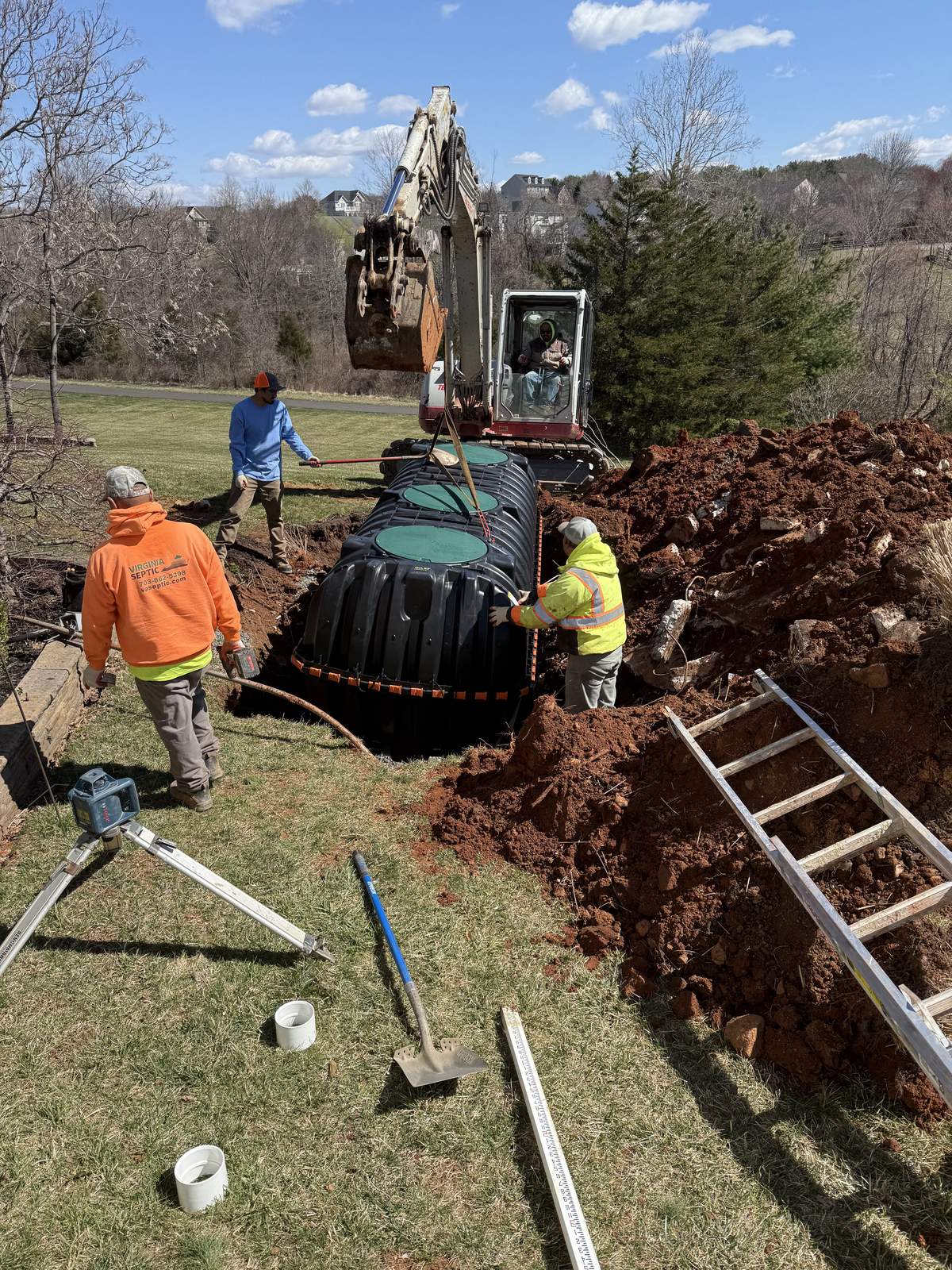 Septic installation digging installation workers machinery