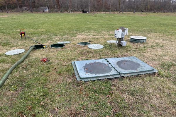 Septic cleaning in progress on a lawn in the Hartfield area