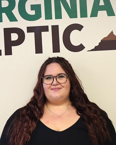 Sarah Virginia Septic worker smiling in front of map background
