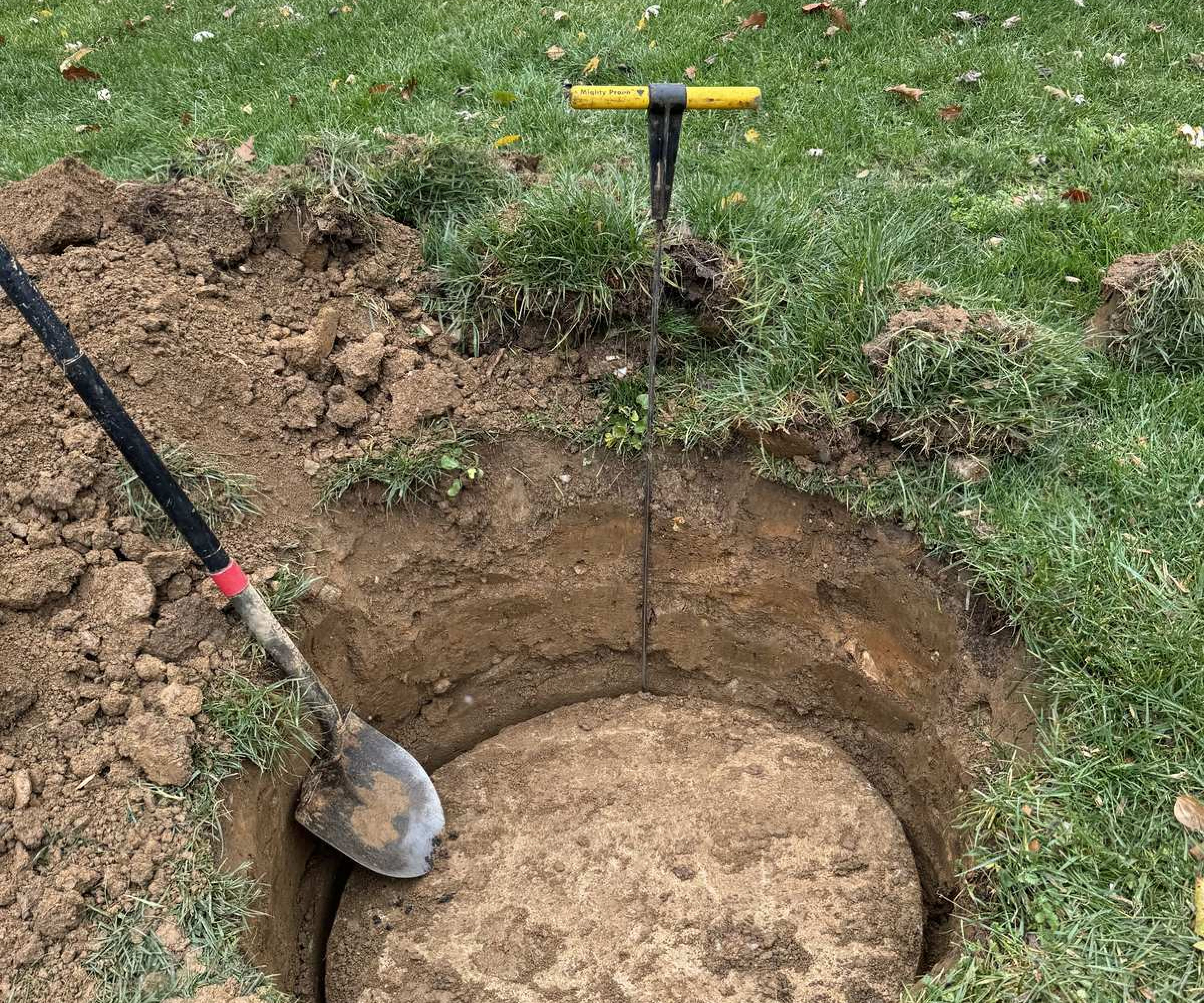 Septic tank cleaning digging out access hole for cleaning